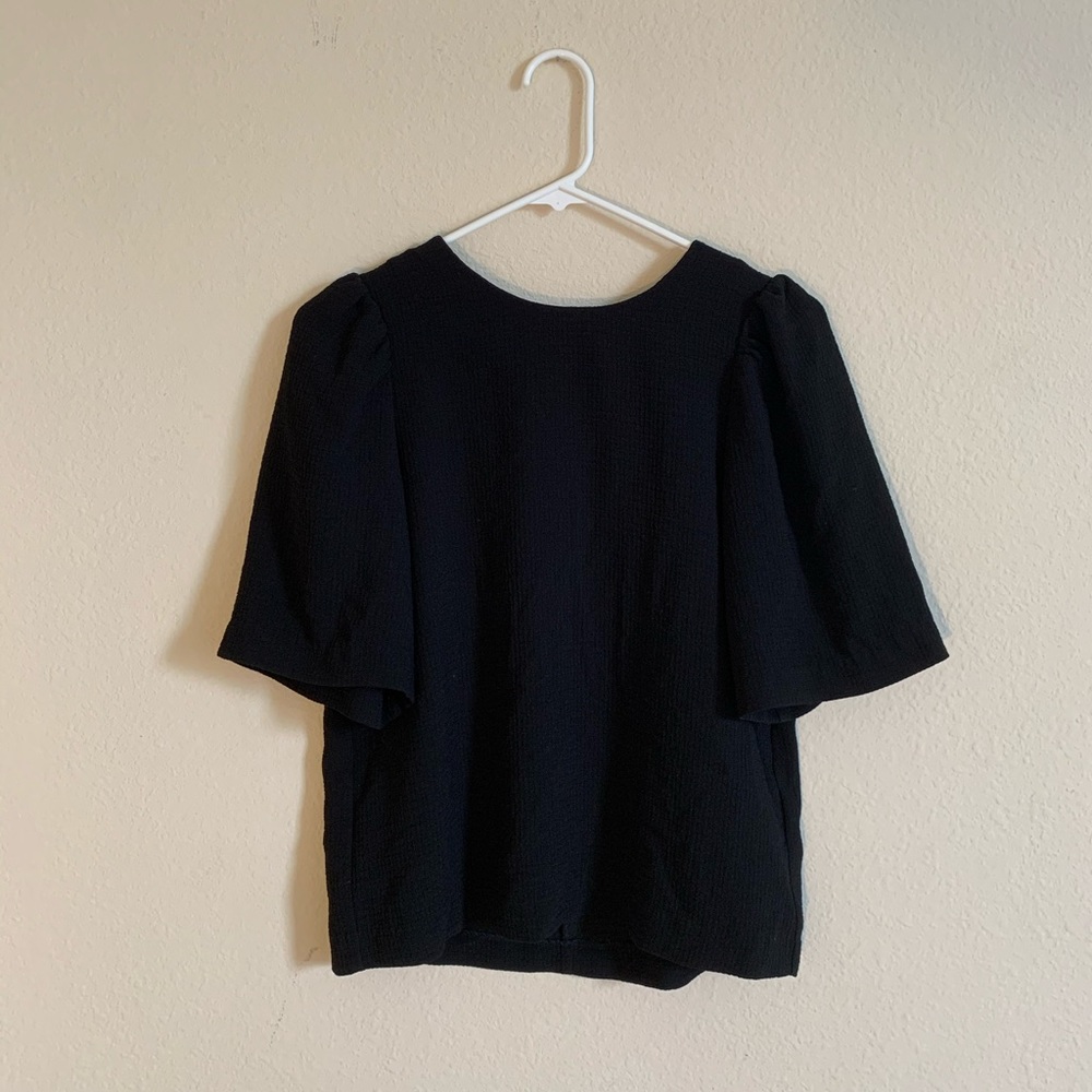 H&M black blouse w/ zipper on the back